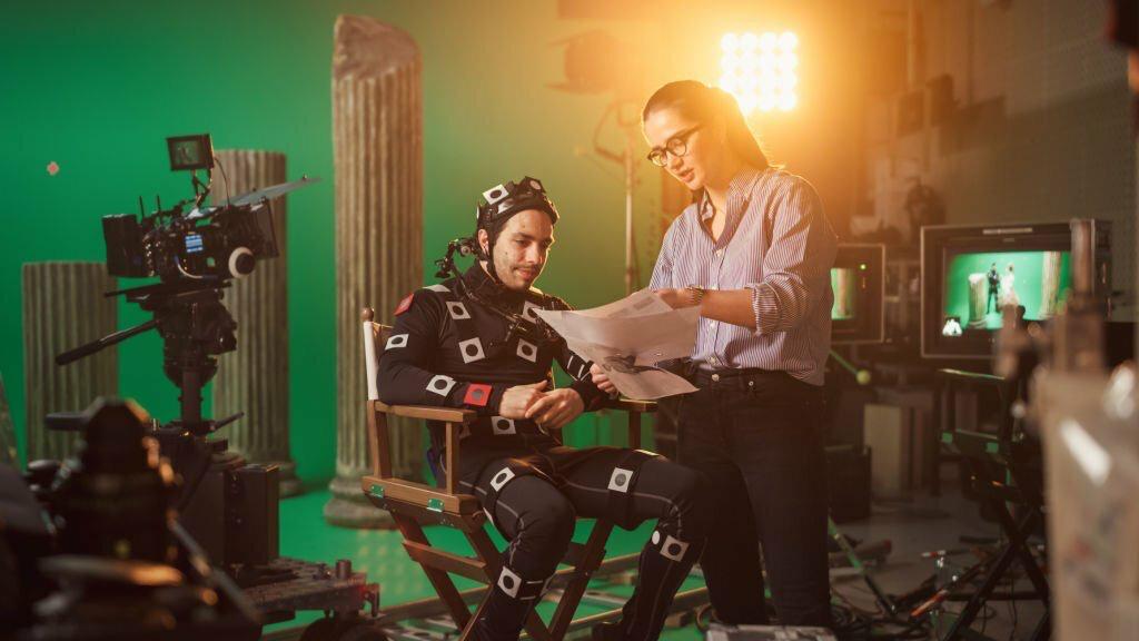 Directors reviewing a scene on a motion-capture set